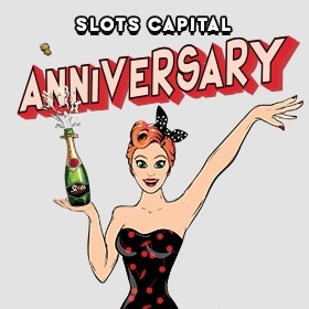 Slots Capital Anniversary, happy Slots Lotty in a black dress with red dots holding a bottle of champagne